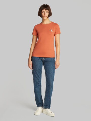 Maglietta di Calvin Klein Jeans in arancione