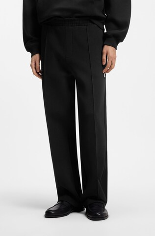 HUGO Loose fit Pants in Black: front