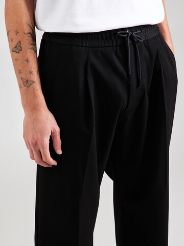 regular Pantaloni con piega frontale 'Ravi243' di HUGO in nero