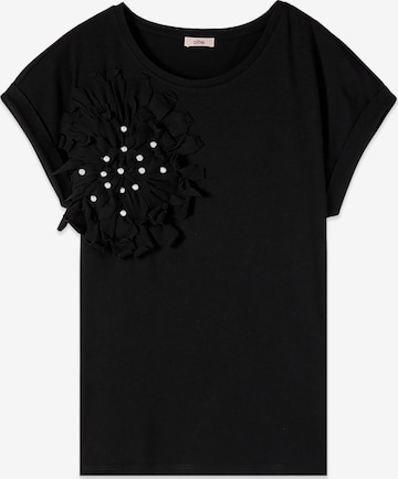 oltre - Camiseta en negro: frente