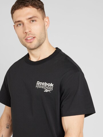 Reebok Shirt 'PROUD' in Schwarz