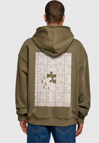 Merchcode Sweatshirt 'Missing Piece' in Green: front