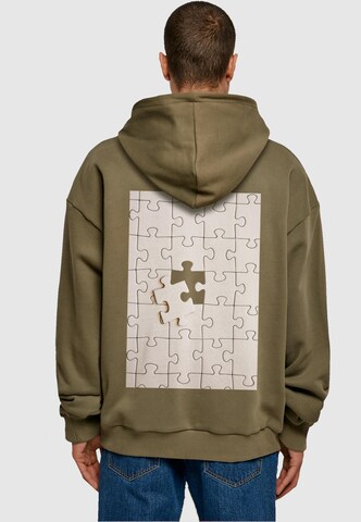 Merchcode Sweatshirt 'Missing Piece' in Grün: Vorderseite