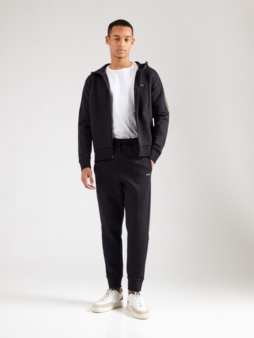 Tapered Pantaloni 'Hadikonos' di BOSS in nero