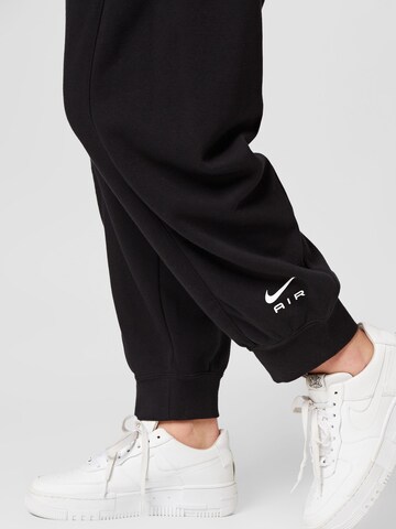 Nike Sportswear Zwężany krój Spodnie sportowe w kolorze czarny