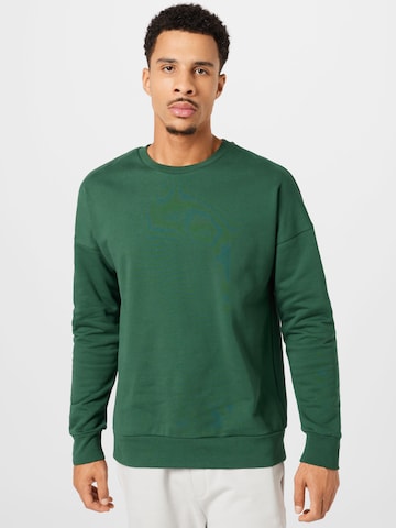 Sweat-shirt Kosta Williams x About You en vert : devant