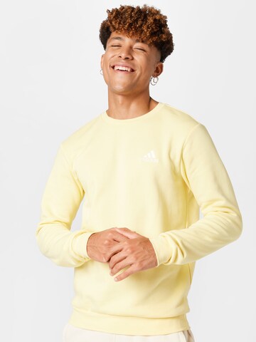 ADIDAS SPORTSWEAR Sports sweatshirt 'Essentials Fleece' in Yellow: front