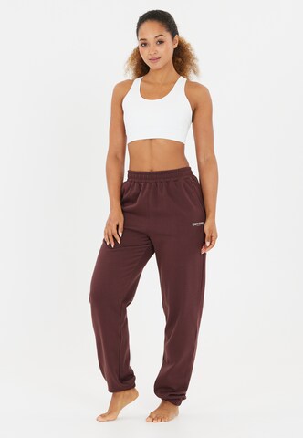 Athlecia Tapered Sportbroek 'Giannis' in Bruin