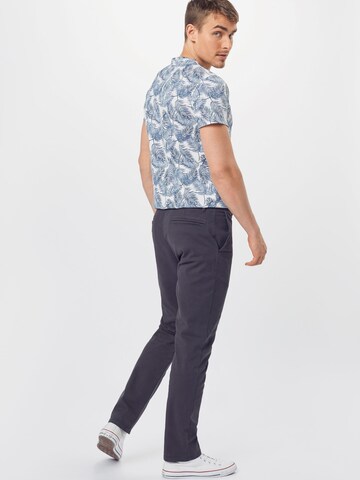 mėlyna ARMEDANGELS Prigludęs Kelnės 'Ato'