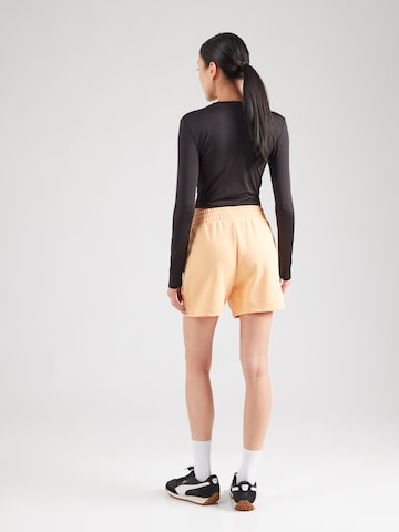 PUMA regular Παντελόνι φόρμας 'ESS Small No. 1' σε πορτοκαλί: πίσω