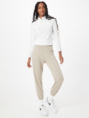 Onzie Tapered Workout Pants in Beige