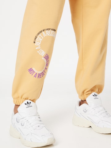 ADIDAS BY STELLA MCCARTNEY Ohlapna forma Športne hlače | rumena barva