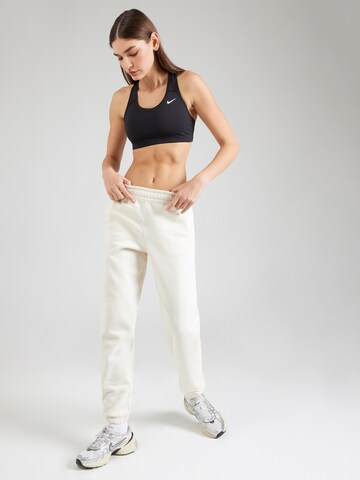 Tapered Pantaloni sportivi di DKNY Performance in bianco