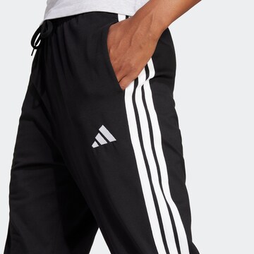 Tapered Pantaloni sport de la ADIDAS SPORTSWEAR pe negru