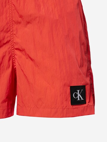 Calvin Klein Swimwear Plavecké šortky – oranžová
