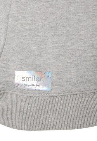 Sweat-shirt smiler. en gris