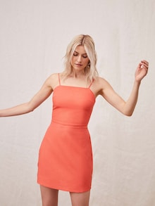 Lena Gercke in een oranje mini-jurk van LeGer