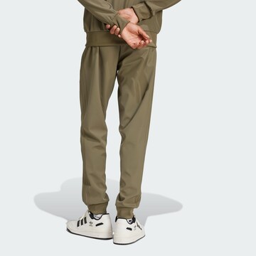 ADIDAS ORIGINALS Tapered Trousers in Green