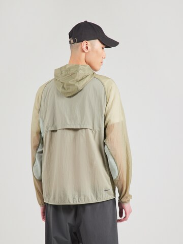 Nike Sportswear Between-season jacket 'TRAIL AIREEZ' in Green: back