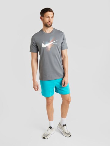 Nike Sportswear Loosefit Kalhoty 'CLUB' – modrá