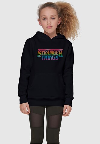 ABSOLUTE CULT Sweatshirt 'Stranger Things - Rainbow' in Black: front