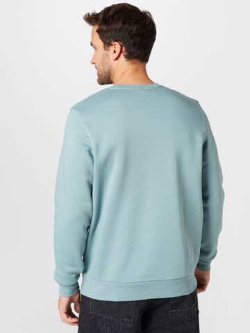 UNDER ARMOUR - Sweatshirt de desporto em verde