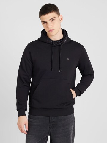 Sweat-shirt Calvin Klein en noir : devant