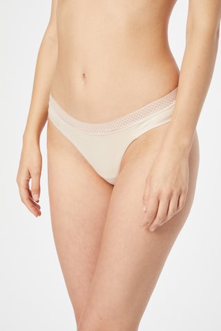 bēšs Calvin Klein Underwear Stringu biksītes: no priekšpuses