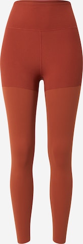 NIKE Skinny Workout Pants in Orange: front