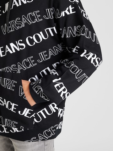 Bluză de molton de la Versace Jeans Couture pe negru