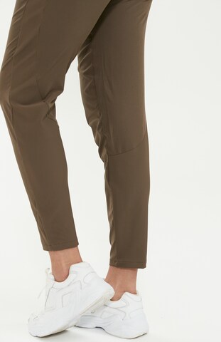 Athlecia Regular Workout Pants 'Timmie' in Brown