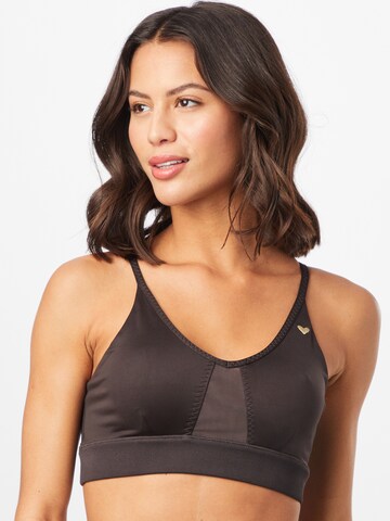 PUMA Bralette Sports Bra in Black: front