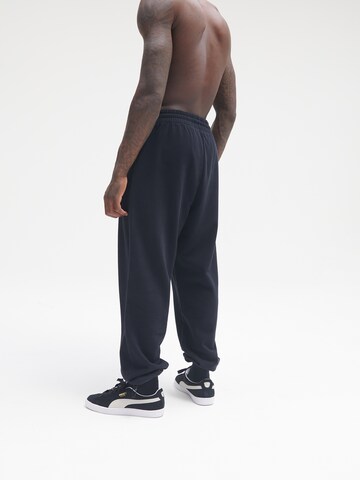 Sinned x ABOUT YOU Loose fit Trousers 'Milo' in Black