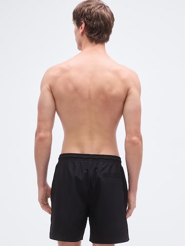 Calvin Klein Swimwear Trachten-housut värissä musta