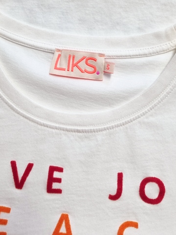 LIKS. Munich - Camiseta 'Tshirt mit Statement Flockprint' en blanco