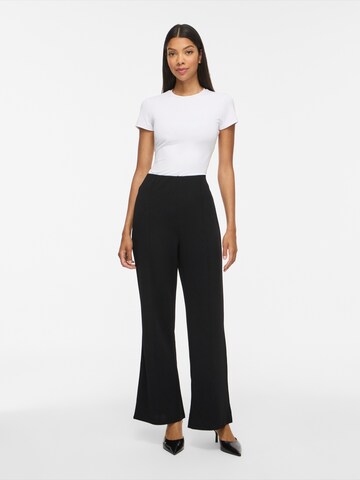 Evazați Pantaloni cu dungă de la VILA pe negru