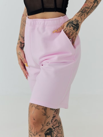 ABOUT YOU x Sharlota Regular Trousers 'Tessa' in Pink