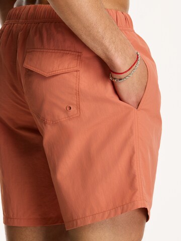 Shiwi Kratke kopalne hlače 'NICK' | oranžna barva