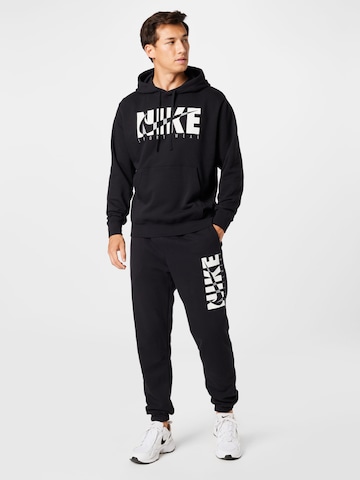 Nike Sportswear Trainingspak in Zwart