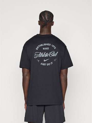 T-Shirt fonctionnel NIKE en noir : devant