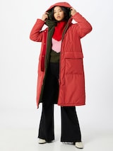 Woman in a long red parka by OOF