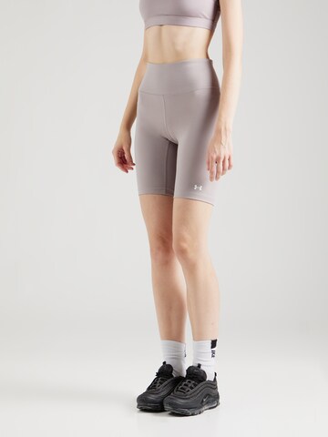 Skinny Pantalon de sport 'Motion' UNDER ARMOUR en gris : devant