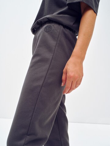 ABOUT YOU x Toni Garrn Regular Trousers 'Kim' in Grey