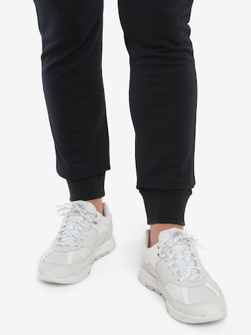 ICEBREAKER Tapered Trousers 'Crush II' in Black