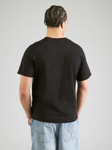 PEAK PERFORMANCE - Camiseta en negro