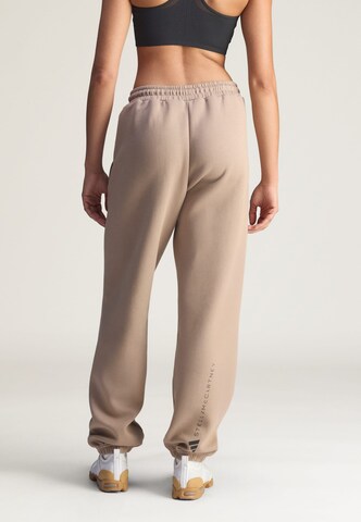 ADIDAS BY STELLA MCCARTNEY - Tapered Pantalón deportivo 'Loose Sweat' en marrón
