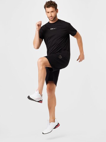 PUMA Normalny krój Spodnie sportowe 'Booster' w kolorze czarny