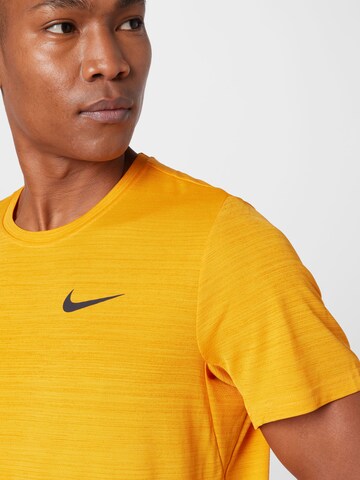 NIKE Performance shirt 'Superset' in Yellow