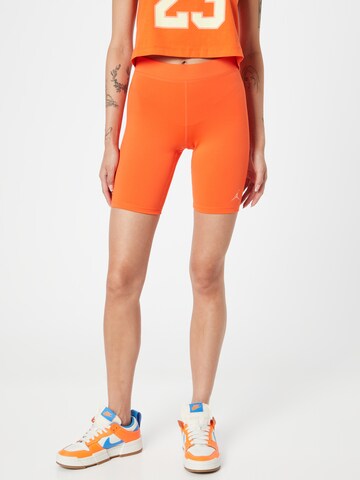 Skinny Pantalon de sport Jordan en orange : devant