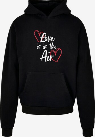 Sweat-shirt 'Valentines Day - Love Is In The Air' Merchcode en noir : devant